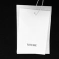 Load image into Gallery viewer, Toteme Black Slit Sleeve Turtleneck Sweater