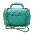 Load image into Gallery viewer, Chanel 2024 Turquoise / Gold Hardware Quilted Lambskin Leather Coco Trip Top Handle Flap Bag