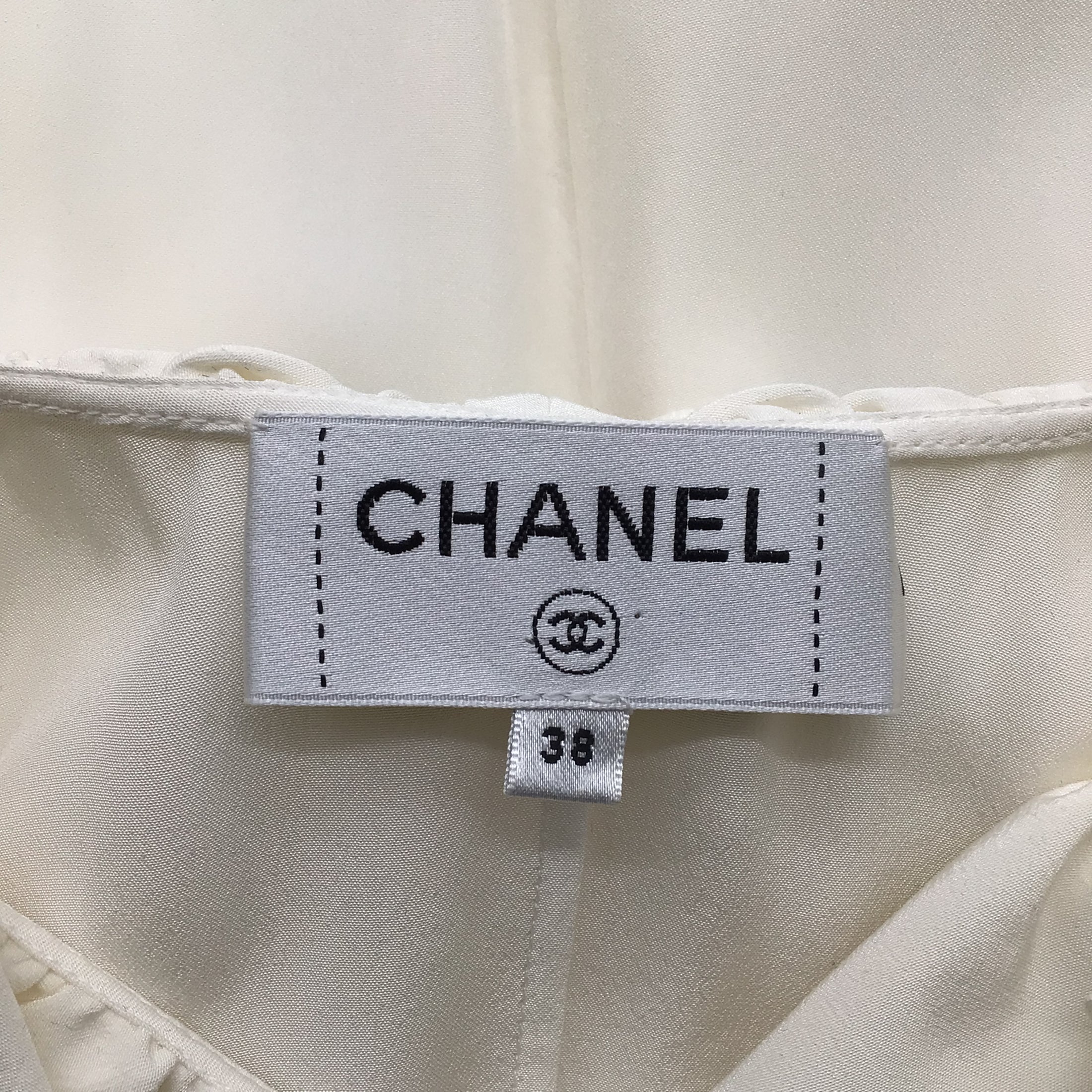 Chanel Ivory CC Logo Buttoned Cold Shoulder Silk Blouse
