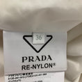Load image into Gallery viewer, Prada Ivory Logo Plaque Re-Nylon Padded Jacket
