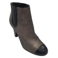 Load image into Gallery viewer, Chanel Gold Metallic / Black CC Logo Cap Toe Pull-On Leather Ankle Boots
