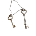 Load image into Gallery viewer, Tiffany & Co. Silver / Gold 925 Sterling Silver Heart Key Pendant and Gold 750 Key Pendant Necklace
