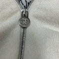 Load image into Gallery viewer, Chanel Ecru Zip Up Cashmere Knit Cardigan with Lion Head and CC Logo Embroidery
