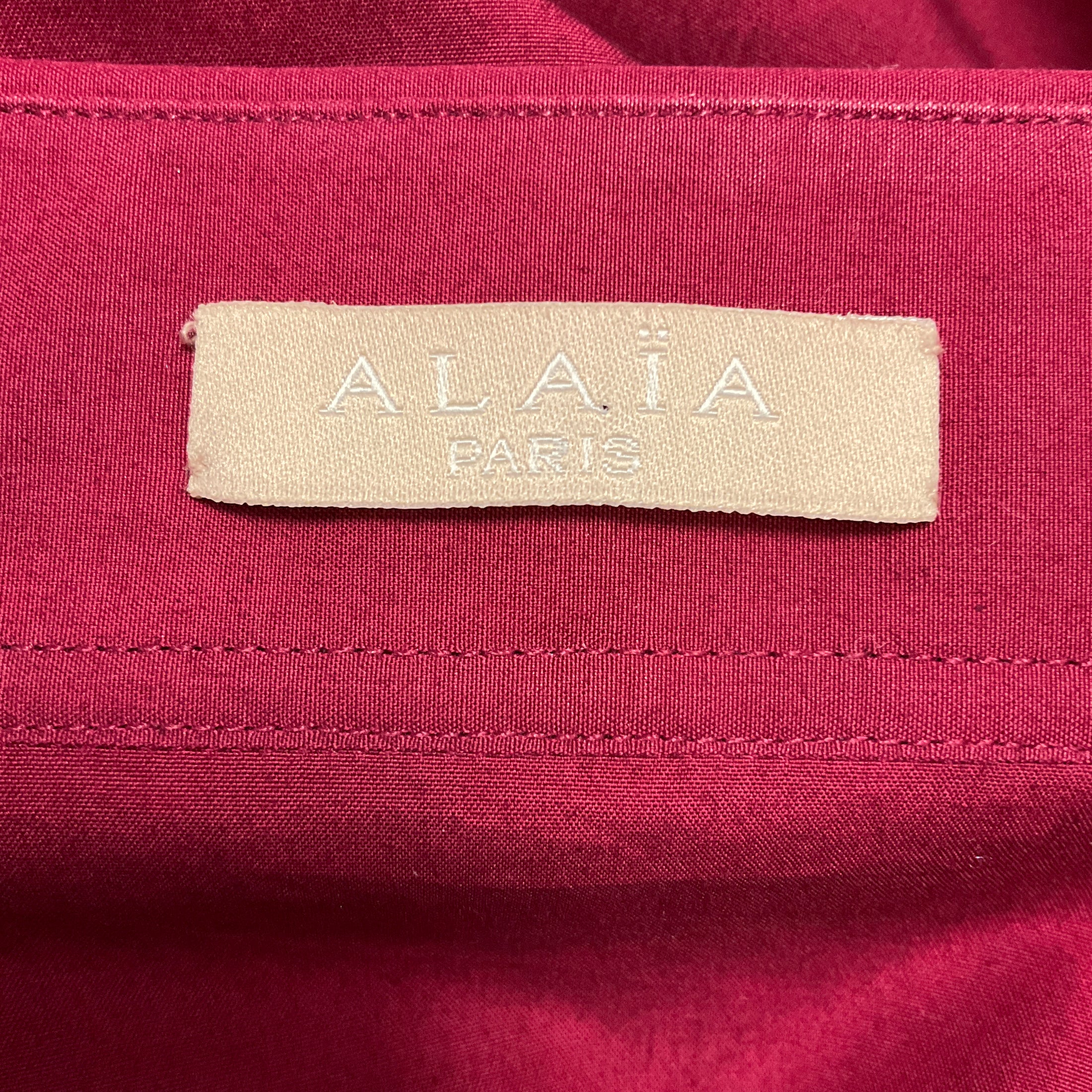 Alaia Cranberry Long Sleeved Peplum Hem Tie Front Button Down Cotton Top
