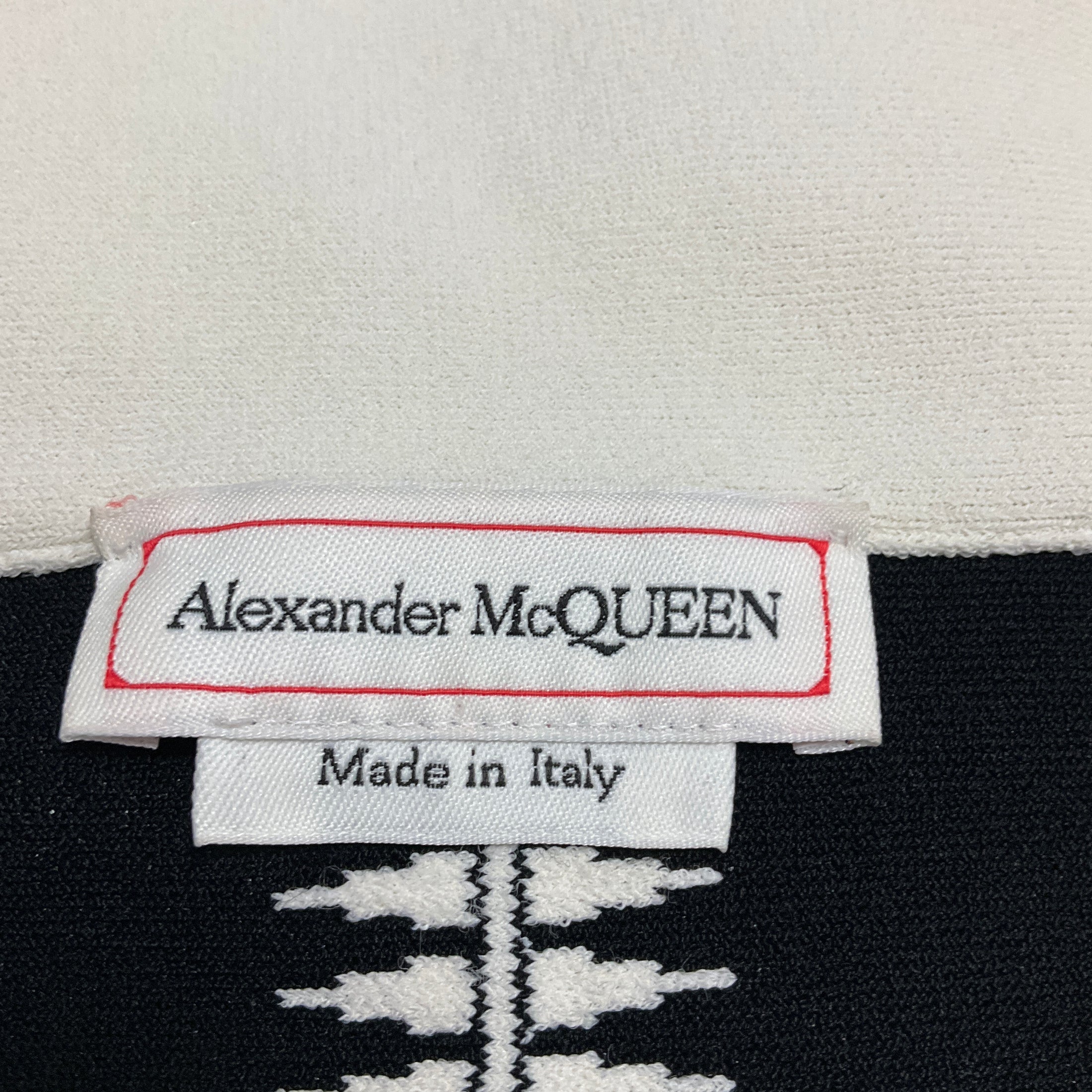 Alexander McQueen Ivory / Black Off-the-Shoulder Fitted Flared Stretch Knit Midi Dress